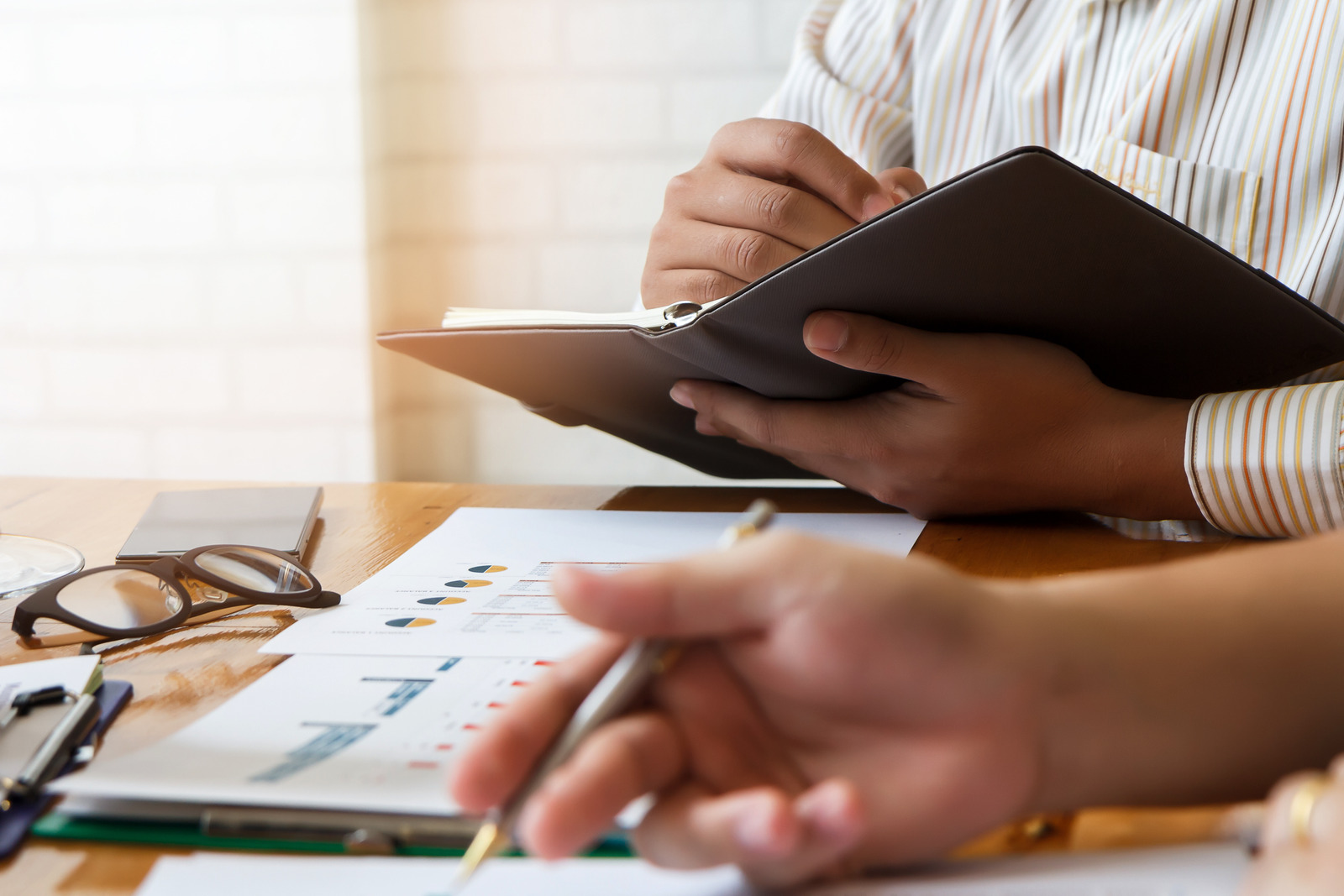 Business team meeting and discussing project plan. Businessmen discussing together in meeting room. Professional investor working with business project together. Finance managers task.